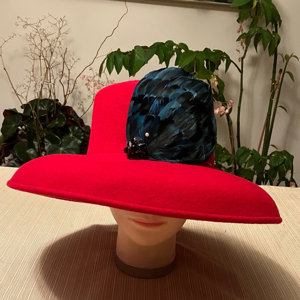 Elegant Red Wool Hat with Blue Feather Accent